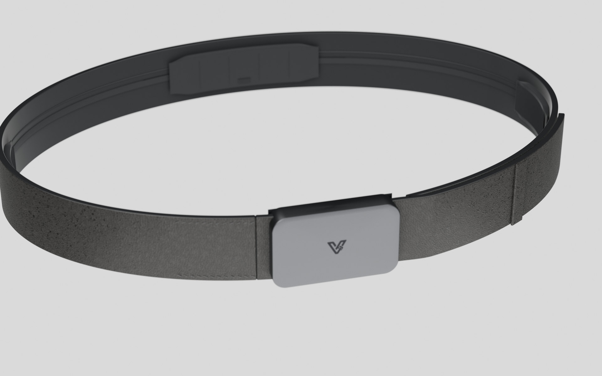 Vyldor belt seen from above at an angle, the full loop of black full-grain leather with the buckle at the front